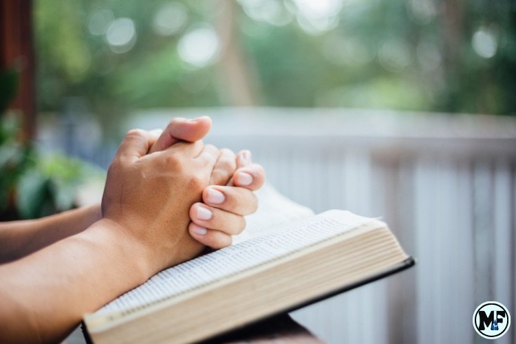 Mercy to Faith blog Images - A Hand on The Bible Seeking for Grace
