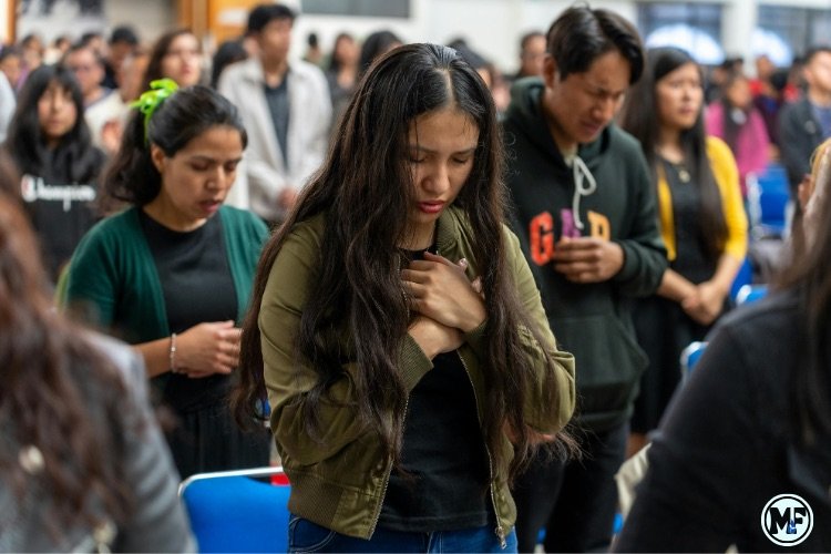 Mercy to Faith blog Images - A Lady Worshipping God in Church