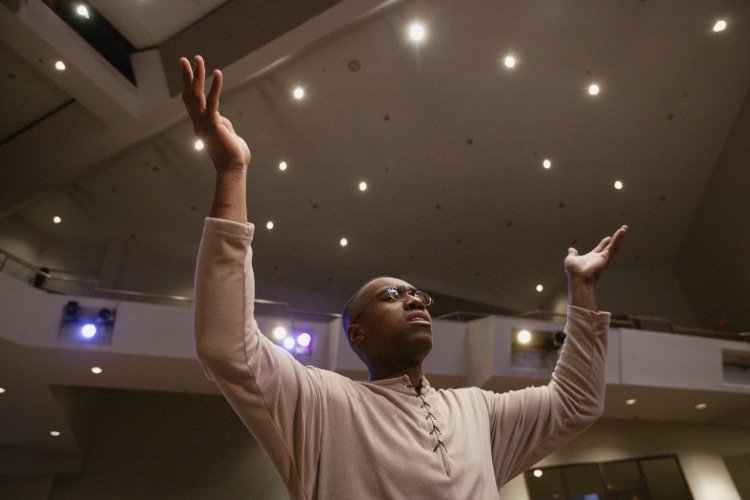 Mercy to Faith blog Images - A Man Worshipping God in Church with Hands Lifted Up