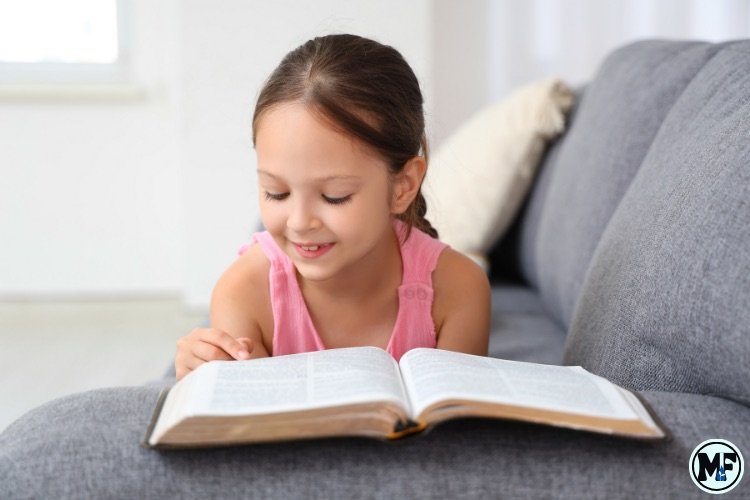 Mercy to Faith blog Images - The Difference Between Studying the Bible and Reading the Bible: A Young Girl Reading the Bible