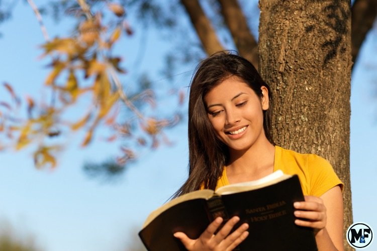 Mercy to Faith blog Images - The Difference Between Studying the Bible and Reading the Bible: A Young Lady Reading The Bible