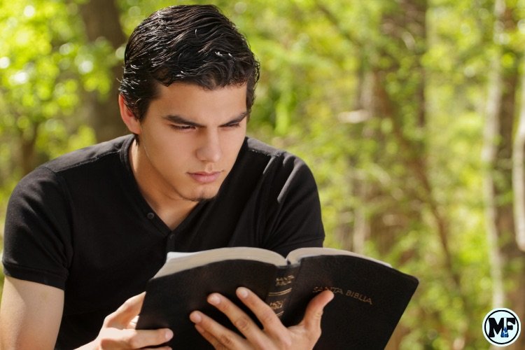 Mercy to Faith blog Images - The Difference Between Studying the Bible and Reading the Bible: A young guy reading