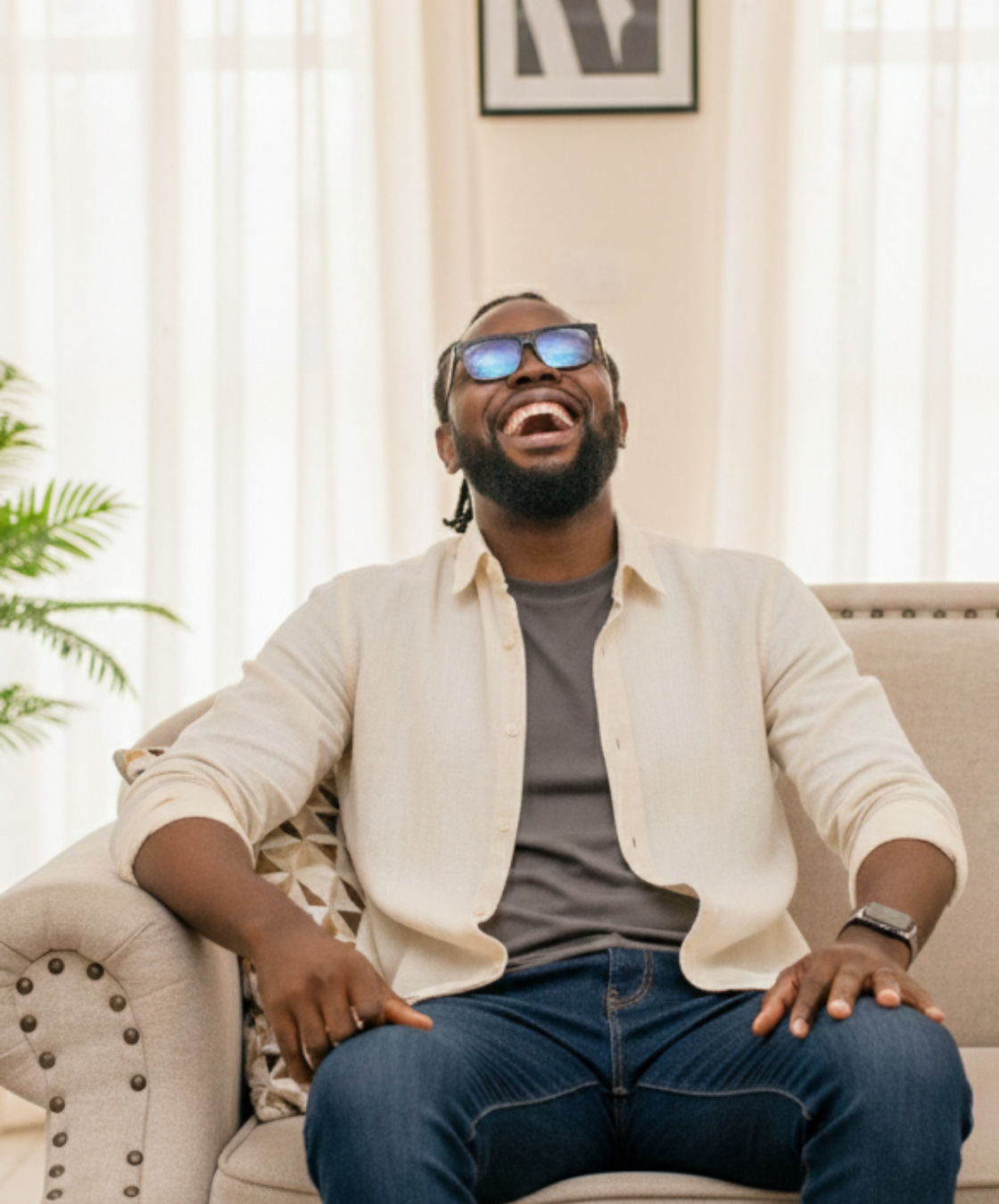 nathan oduononwi laughing in his living room